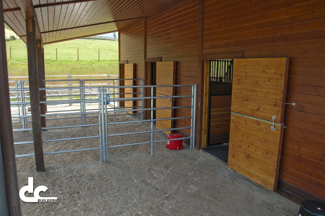 Your horses will love the amenities in this custom horse barn from DC Builders.