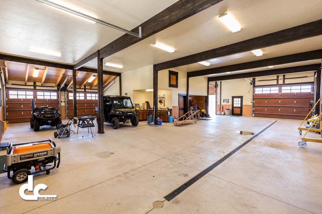 This hunting cabin has a spacious garage to store tools and vehicles.