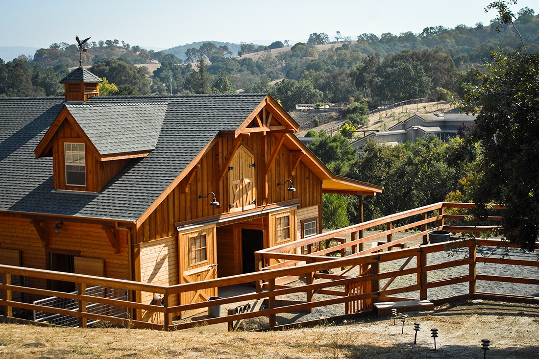 This horse barn and riding area was built in Woodside, California by DC Builders.