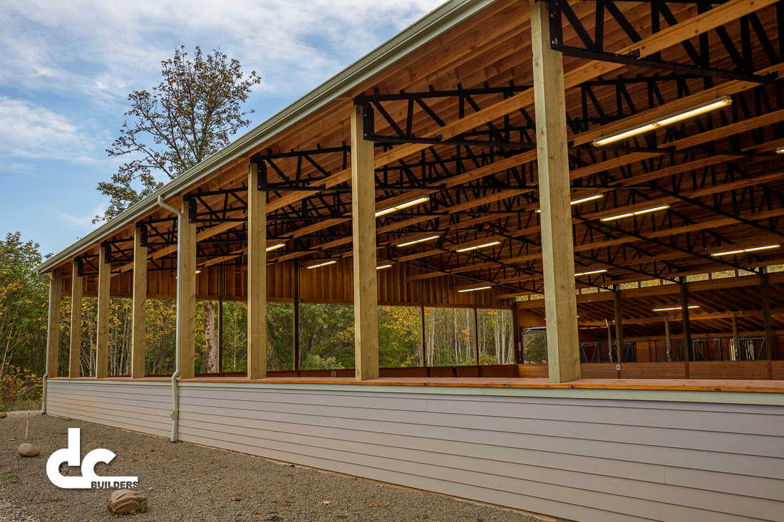 This large covered riding arena and equestrian facility was expertly built by DC Builders to stand the test of time.