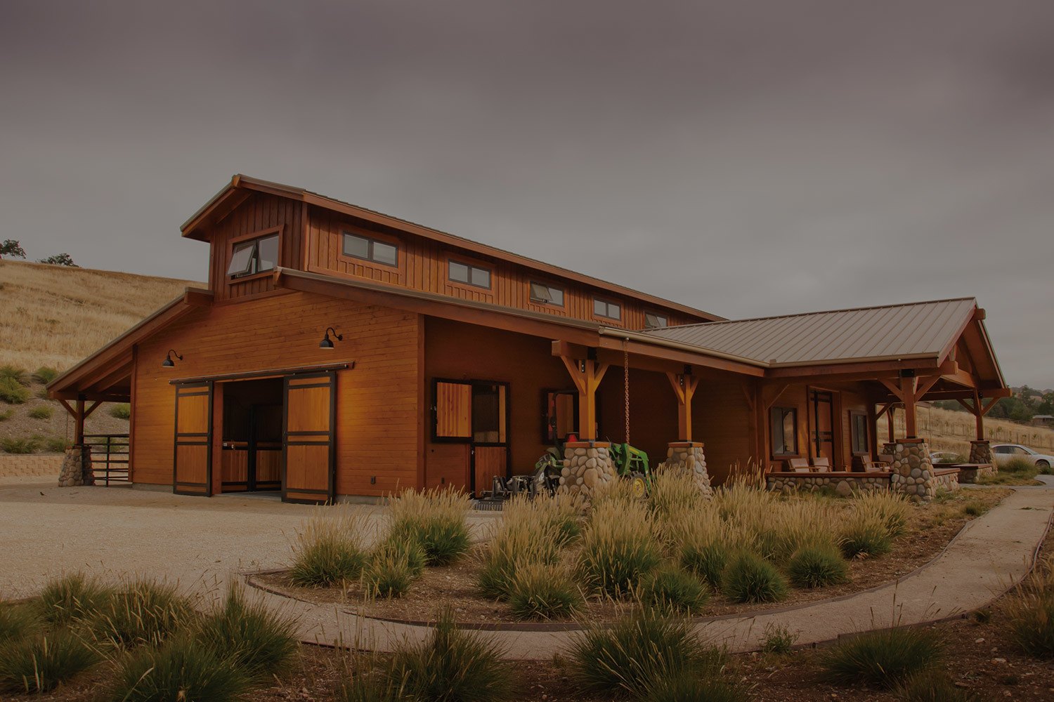 This barn home in California has a custom covered patio and living quarters.